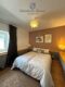 Wohn- und Geschäftshaus plus Nebengebäude und Grundstück - Ferienwohnung Schlafzimmer