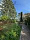Gepflegtes 2-3 Familienhaus mit Garten + Garage, sofort verfügbar - Gebäuderückseite