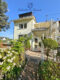 Gepflegtes 2-3 Familienhaus mit Garten + Garage, sofort verfügbar - Hausrückseite